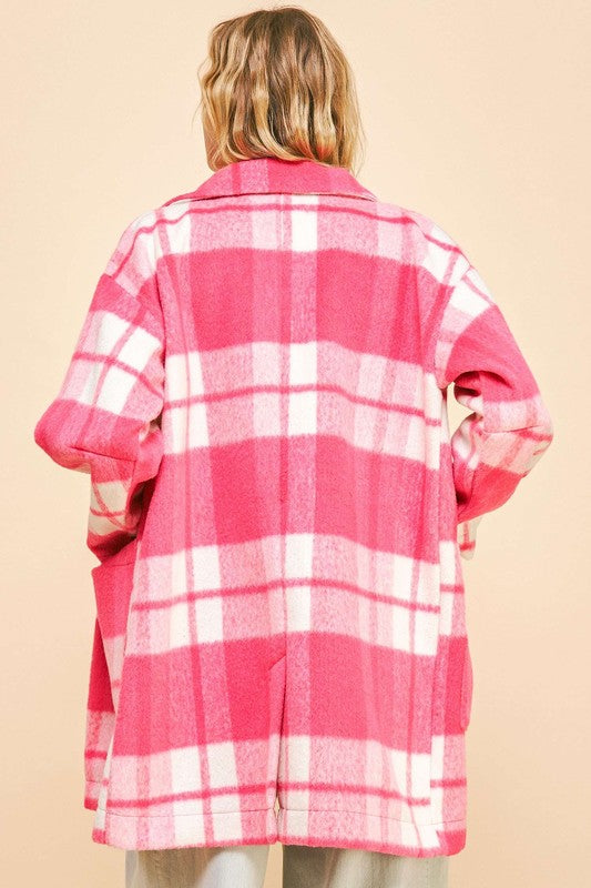 Pink plaid open front longline coat with drop shoulders and pockets, made from 100% polyester, viewed from the back.