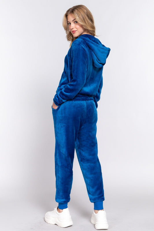 Woman wearing deep blue faux fur zip-up hoodie and joggers set, showcasing cozy casual style from Active Basic.