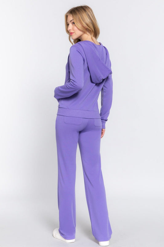 Woman in purple French terry zip-up hoodie and drawstring pants set, showcasing casual comfort and style from Active Basic.
