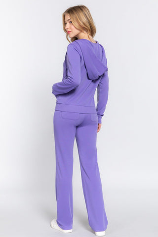 Woman in purple French terry zip-up hoodie and drawstring pants set, showcasing casual comfort and style from Active Basic.