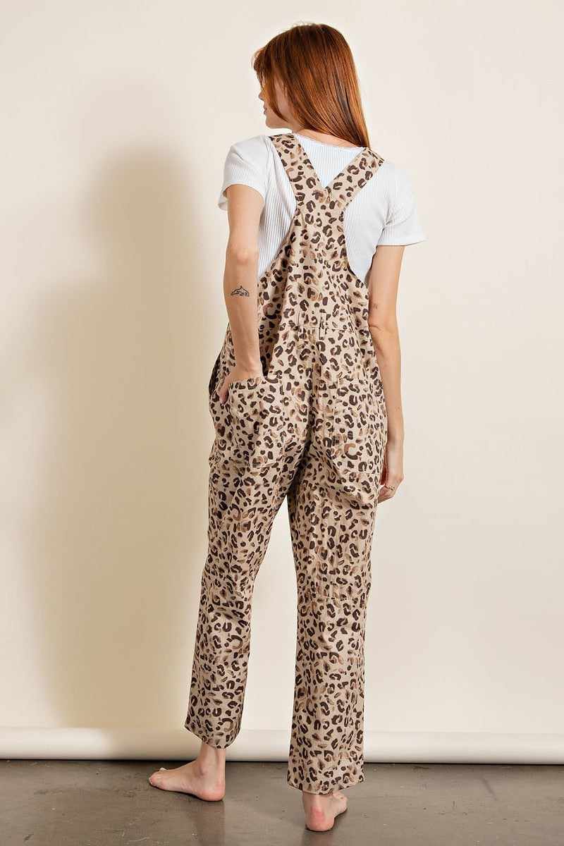 Leopard printed jumpsuit with racer back design, relaxed fit, and unisex neckline, made from 100% cotton khaki.