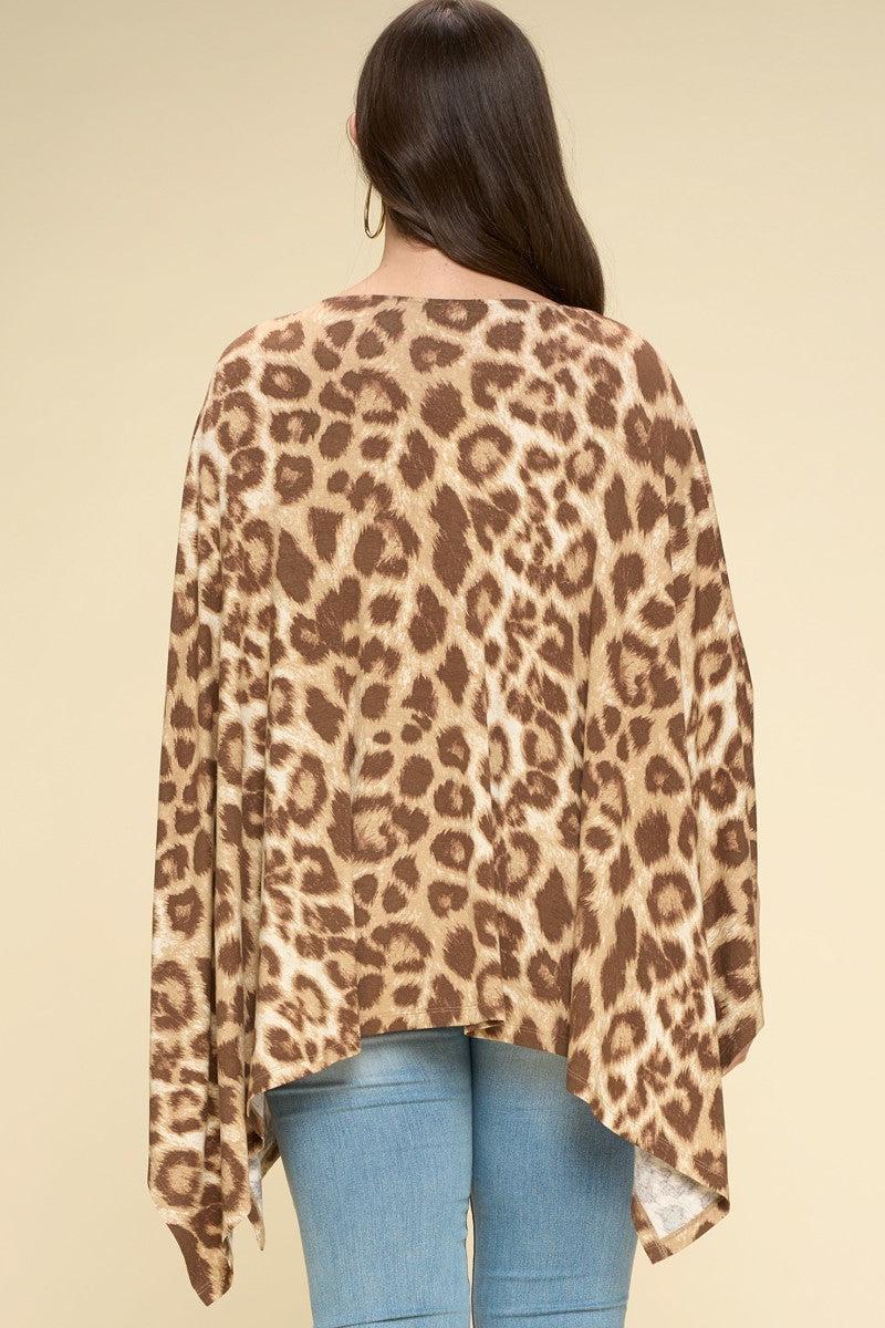 Animal printed rayon poncho with sharkbite hem and boat neckline in khaki, featuring a chic design for plus sizes, seen from the back.