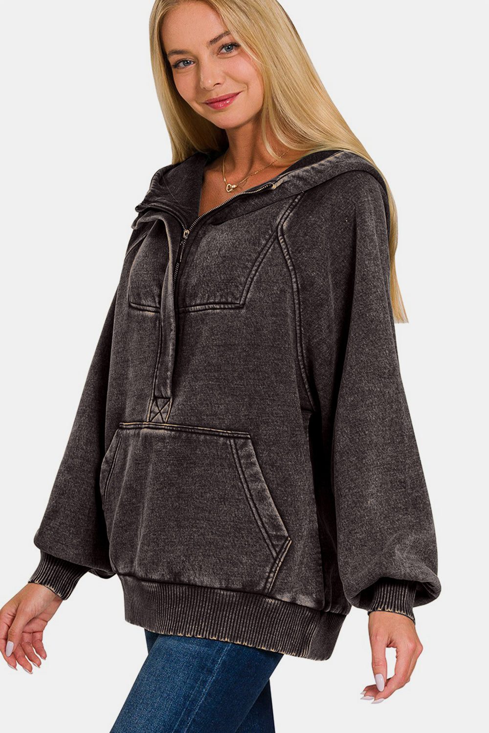 Ash black acid wash fleece kangaroo hoodie with front pockets, worn by a model.