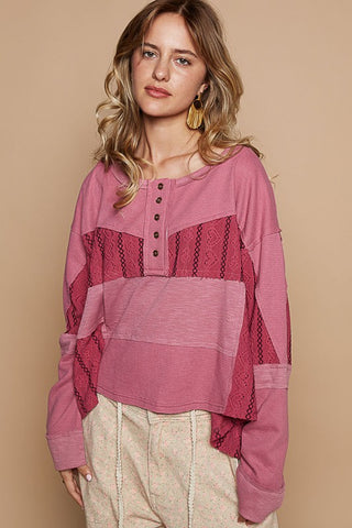 Cerise half button color block waffle-knit drop shoulder top with eyelet and exposed seam, featuring a cozy design.