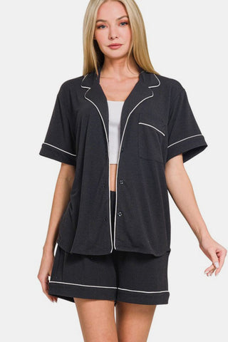 Black button-down short sleeve top and shorts lounge set with pocket, slightly stretchy fabric.