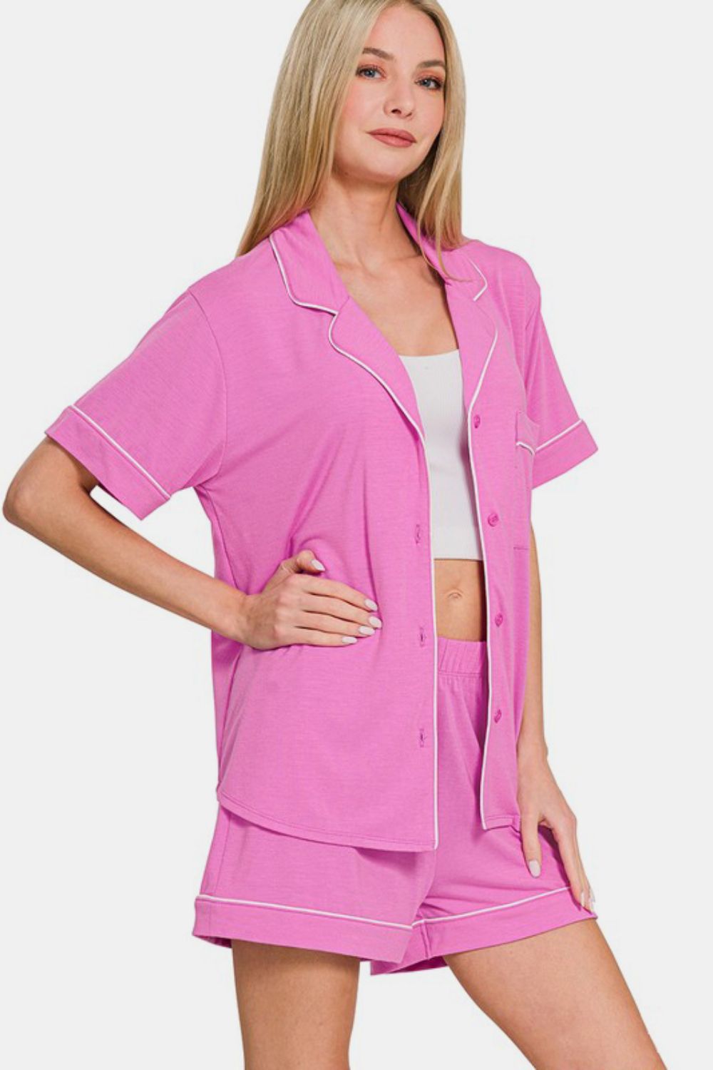 Bright mauve button-down top and shorts lounge set with pockets, slightly stretchy, made of polyester, rayon, and spandex.