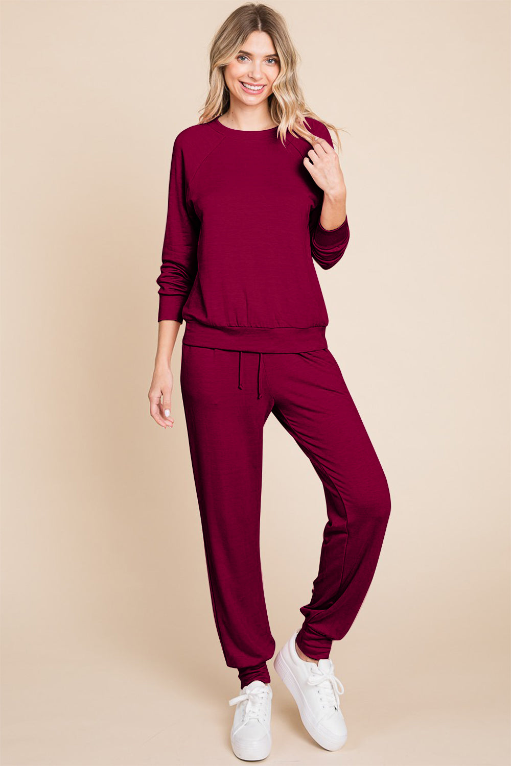 Burgundy round neck raglan sleeve top and pants lounge set, featuring a basic two-piece style in slightly stretchy polyester blend.