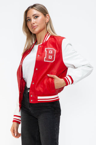 Red and white PU leather baseball bomber jacket with contrast snap down and letter B detail, worn by a model.