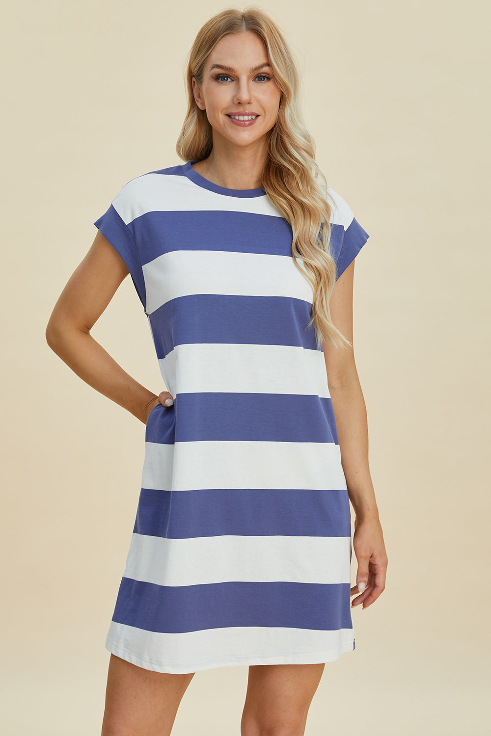 Woman wearing Basic Bae striped round neck cap sleeve mini dress with blue and white stripes, slightly stretchy fabric.