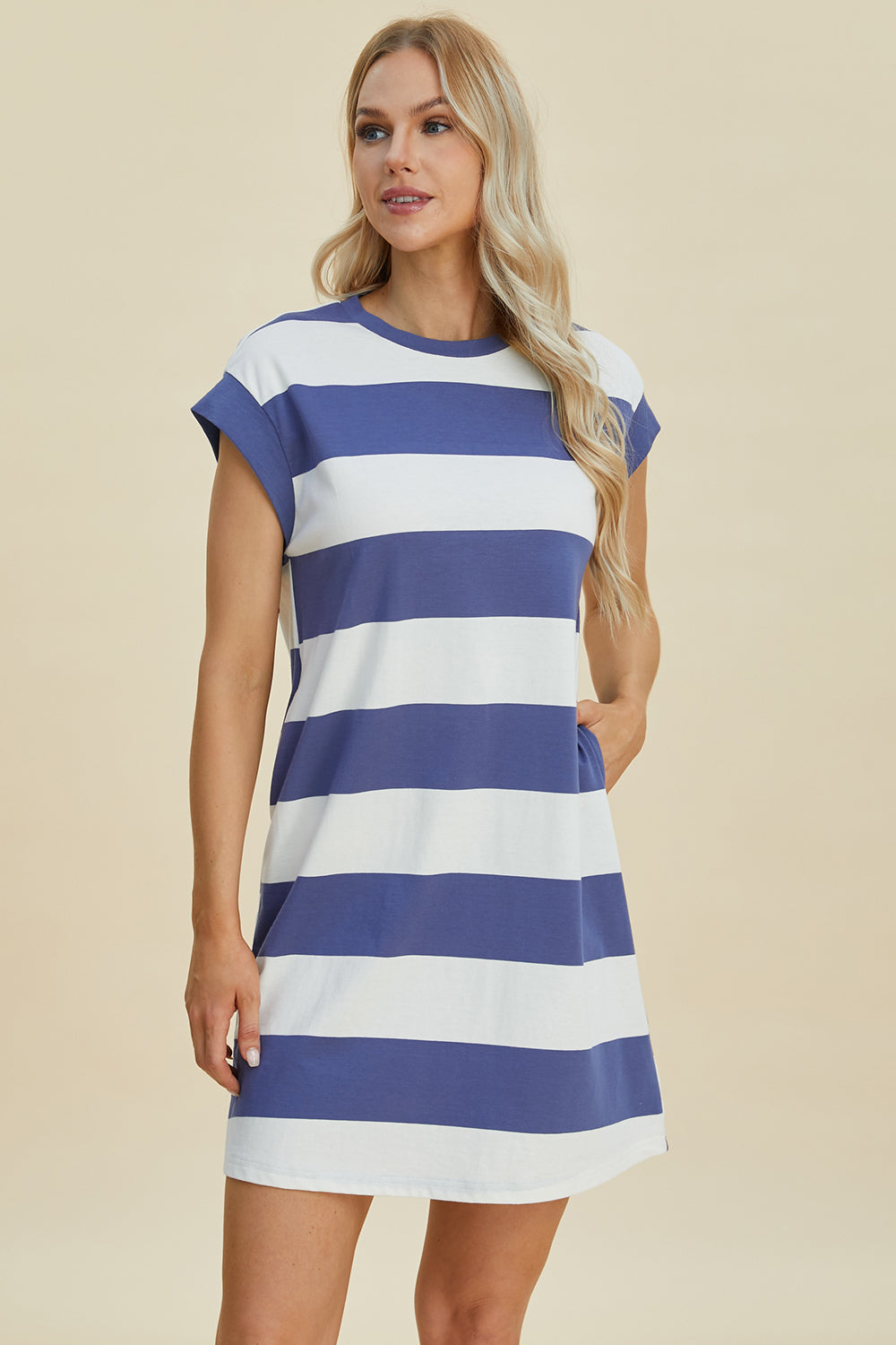 Woman wearing Basic Bae Striped Round Neck Cap Sleeve Mini Dress, blue and white stripes, casual summer fashion.