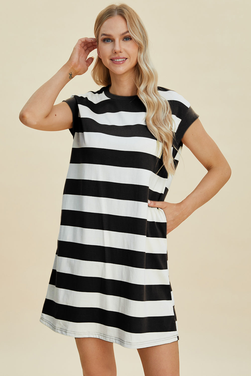 Woman wearing Basic Bae striped round neck cap sleeve mini dress, slightly stretchy, black and white stripes, 50% polyester, 50% cotton.