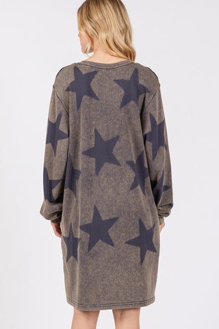 Woman wearing dark gray washed star print round neck dress, back view. Opaque with a slightly stretchy, 100% cotton fabric.