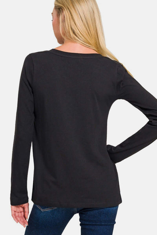 Woman wearing black full-size V-neck long sleeve T-shirt, made of 95% cotton and 5% spandex, with slightly stretchy fabric.