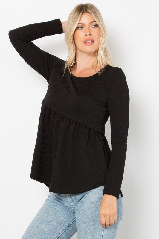 Black full-size knit top with round neck and long sleeves, featuring a cable-knit peplum design and slightly stretchy fabric.