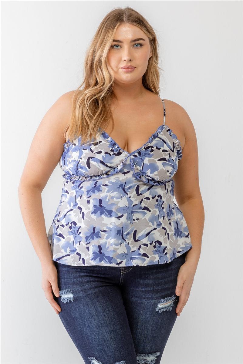 Plus size model wearing blue floral print woven tank top with ruffle, v-neckline, and adjustable straps. Casual and trendy style.