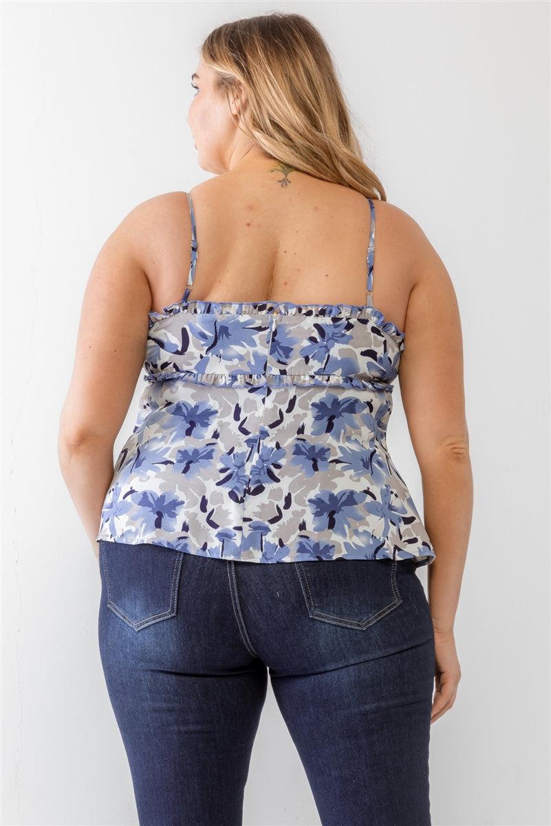 Plus size floral blue woven tank top with ruffle and adjustable straps, back view, worn by a model in jeans, casual style.