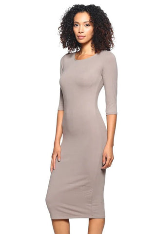 Woman wearing a fitted taupe midi bodycon dress with 3/4 length sleeves and scoop back, made of stretch knit fabric.