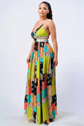 Boho Chic Crossed Back Maxi Dress with vibrant patterns, sleeveless design, deep V-neck, perfect for parties, vacations, and beach outings.