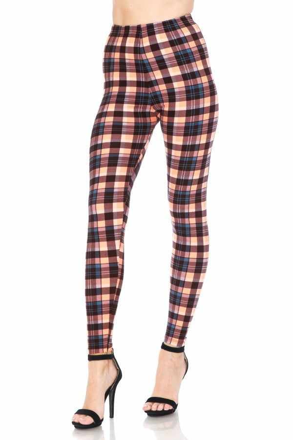 Multi-colored plaid high-waisted leggings with an elasticized waist band, styled with black heels.