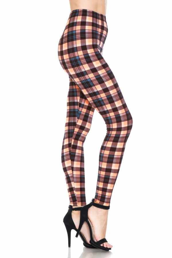 Multi-patterned high-waisted leggings in vibrant plaid with elasticized waistband, showcasing a stylish fit.