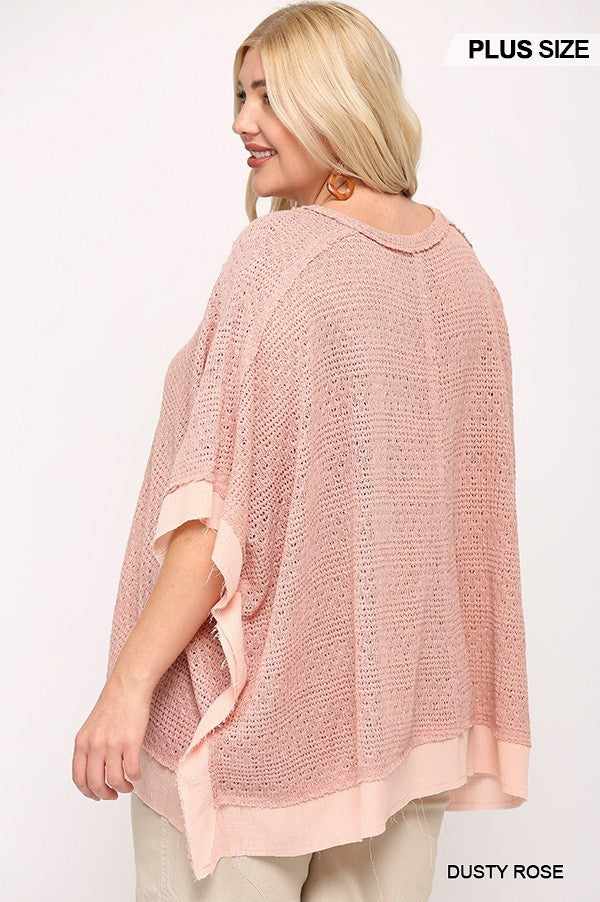 Plus size woman wearing a dusty rose light knit and woven mixed boxy top with poncho sleeves.