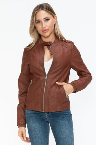 Brandy PU leather biker jacket with side zip pockets, showing basic style and normal thickness in brown, worn by model.