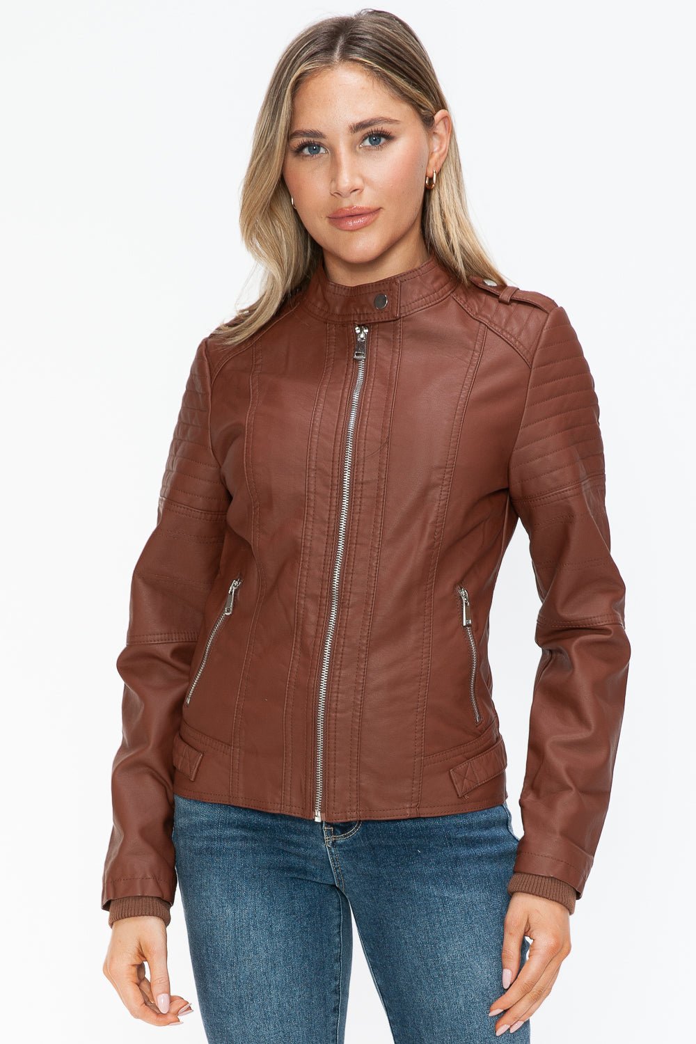 Woman wearing brown Brandy PU leather biker jacket with side zip pockets