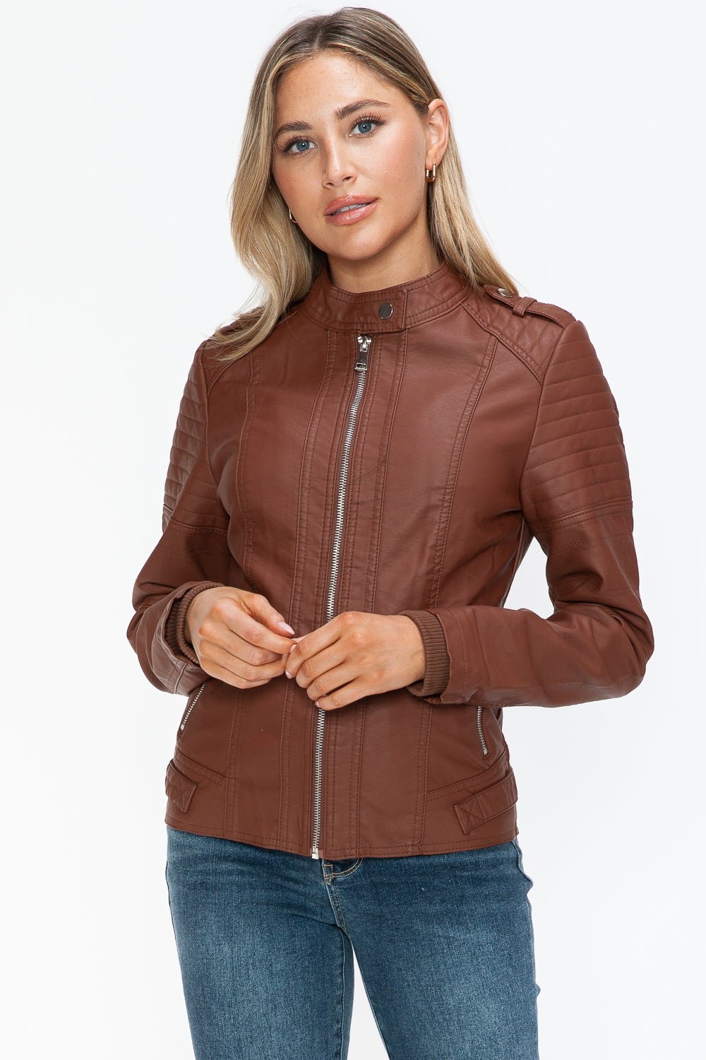 Woman wearing Brandy PU Leather Biker Jacket with side zip pockets, featuring a basic style and normal thickness.