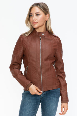 Brandy PU leather biker jacket with side zip pockets, featuring a basic style and normal thickness, worn by a woman in jeans.
