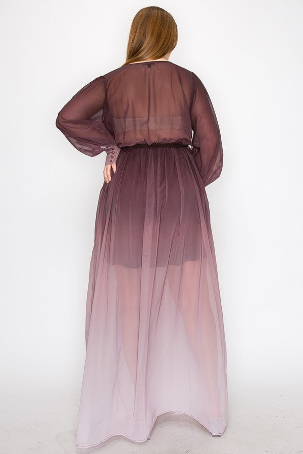 Curvy woman wearing a brown ombre long sleeve tie waist slit front maxi dress with sheer chiffon fabric, viewed from the back.