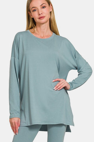 Woman wearing brushed microfiber lounge set in teal with long sleeves and a flattering silhouette.