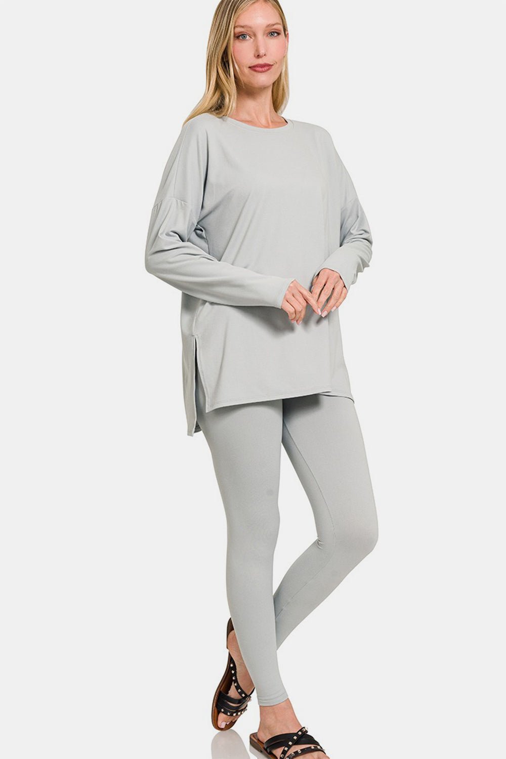Woman wearing a gray brushed microfiber top and leggings lounge set with trendy slit, perfect for versatile and flattering style.
