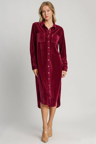 Burgundy texture curved hem button-down shirt dress with pockets and slit, long-sleeve design, slightly stretchy material.