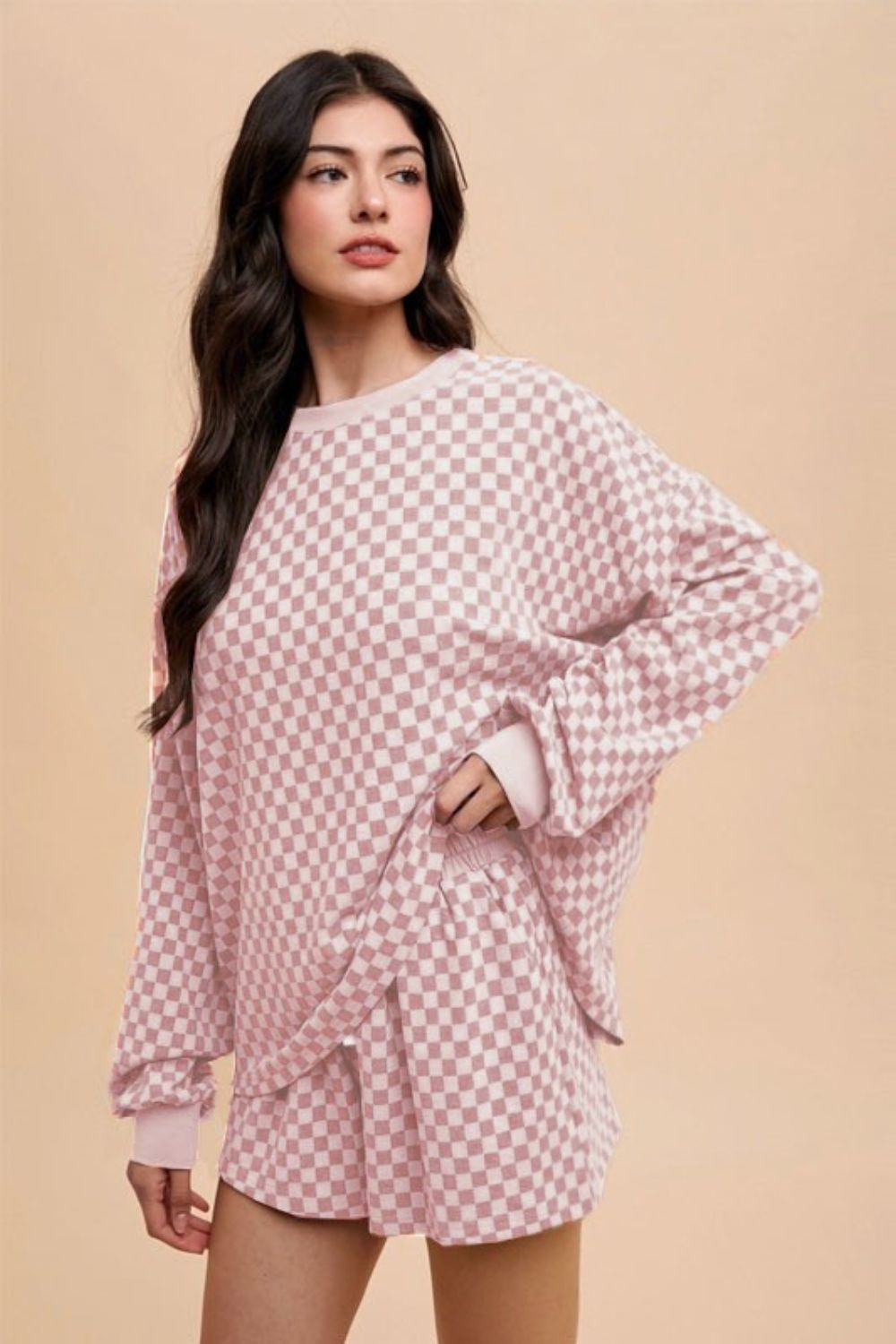 Blush pink checkered round neck top and drawstring shorts set, featuring a basic style with pockets, made from slightly stretchy polyester-spandex.