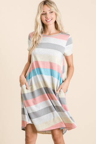 Woman wearing a multicolor striped short sleeve dress with pockets, made of polyester and spandex, slightly stretchy, basic style.