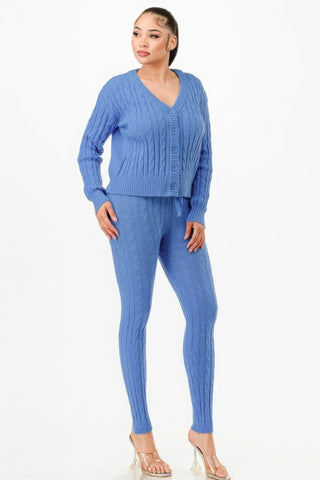 Woman wearing blue cable knit sweater cardigan 2-piece set with matching pants, showcasing chic and cozy fashion style.