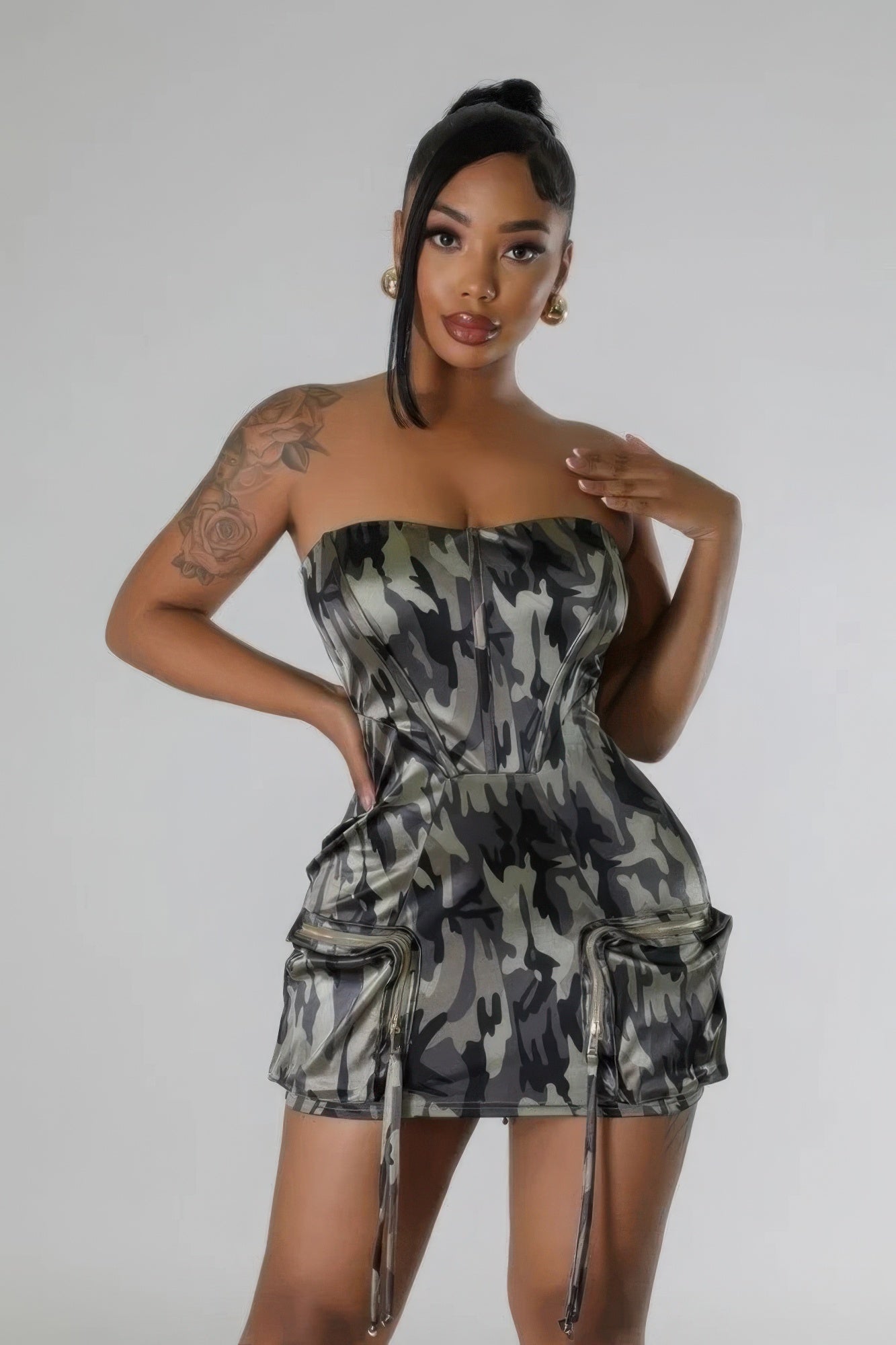 Camouflage print stretch tube dress with zipper closure and pockets, featuring a flattering silhouette for day to night wear.