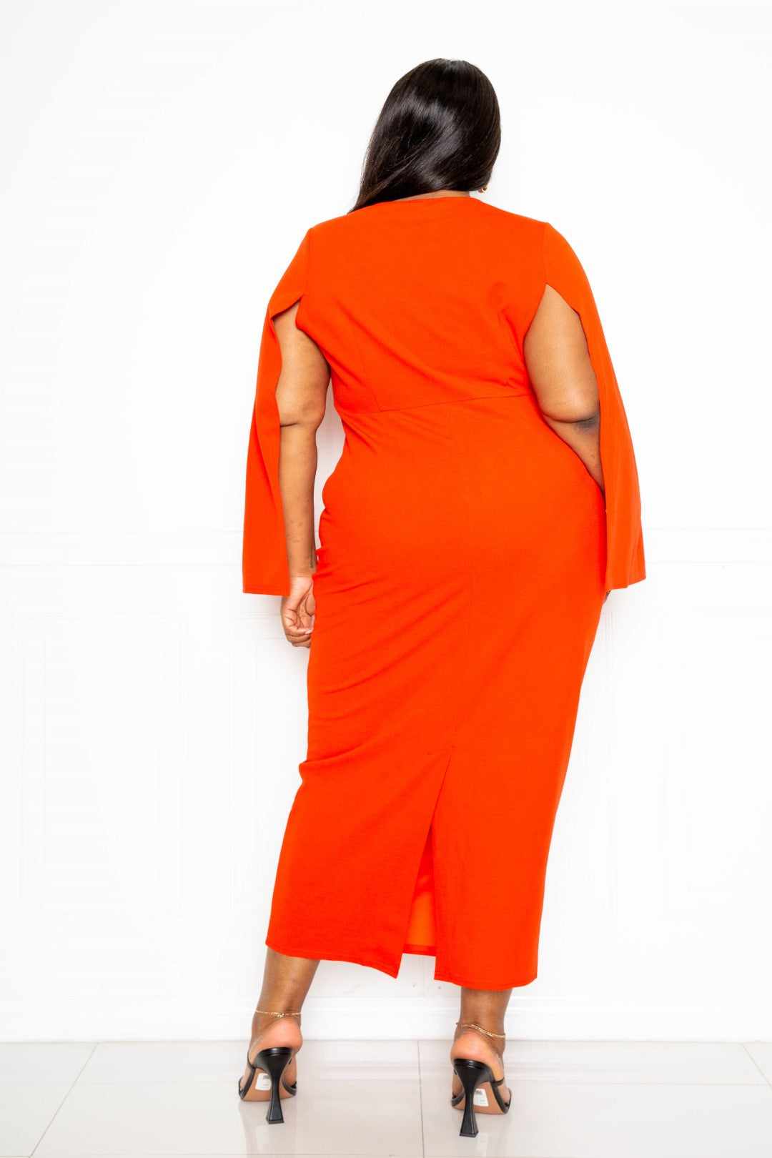 Plus size orange-red cape sleeve dress with knot detail, back view showing comfortable fit, available in 1XL, 2XL, and 3XL sizes.