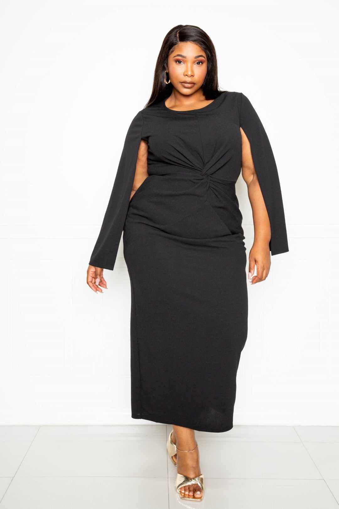 Black cape sleeve dress with knot detail, available in plus sizes 1XL-3XL, made of polyester and spandex.