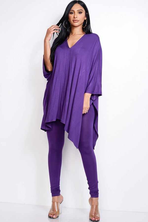 Woman wearing eggplant solid heavy rayon spandex cape top and leggings two-piece set, highlighting USA-made fashion apparel.