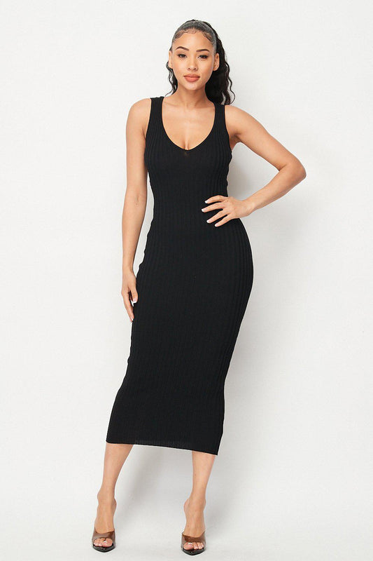 Woman wearing Carmen Ribbed Knit Midi Dress in black, showcasing the stylish and comfortable design made from 100% viscose.