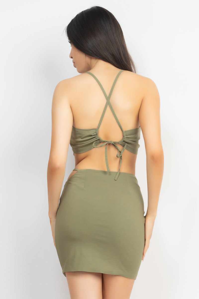 Olive asymmetrical cross back top and skirt set with sleeveless design, drawstring tie, side cutout, and mini length.