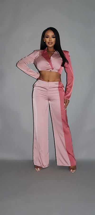 Woman wearing colorblock crop blazer and low rise wide leg pant set in blush with pockets, styled for a modern, chic look.