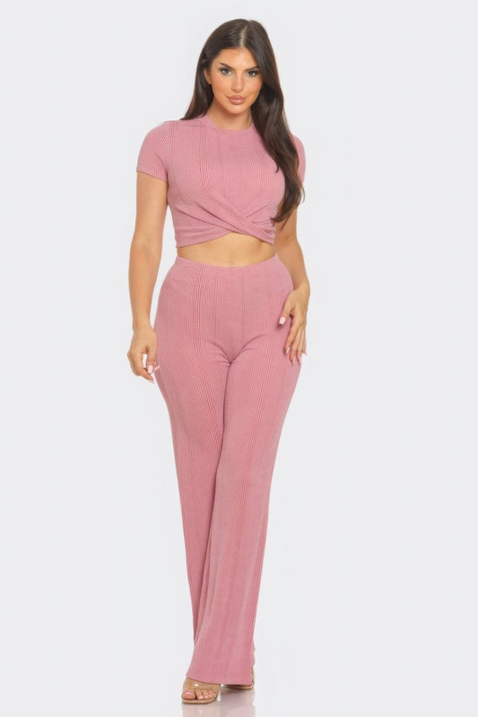 Chic Front Twist Detail Top and Flare Pants Set in pink, featuring a flattering rib knit fabric for stylish day or night looks.