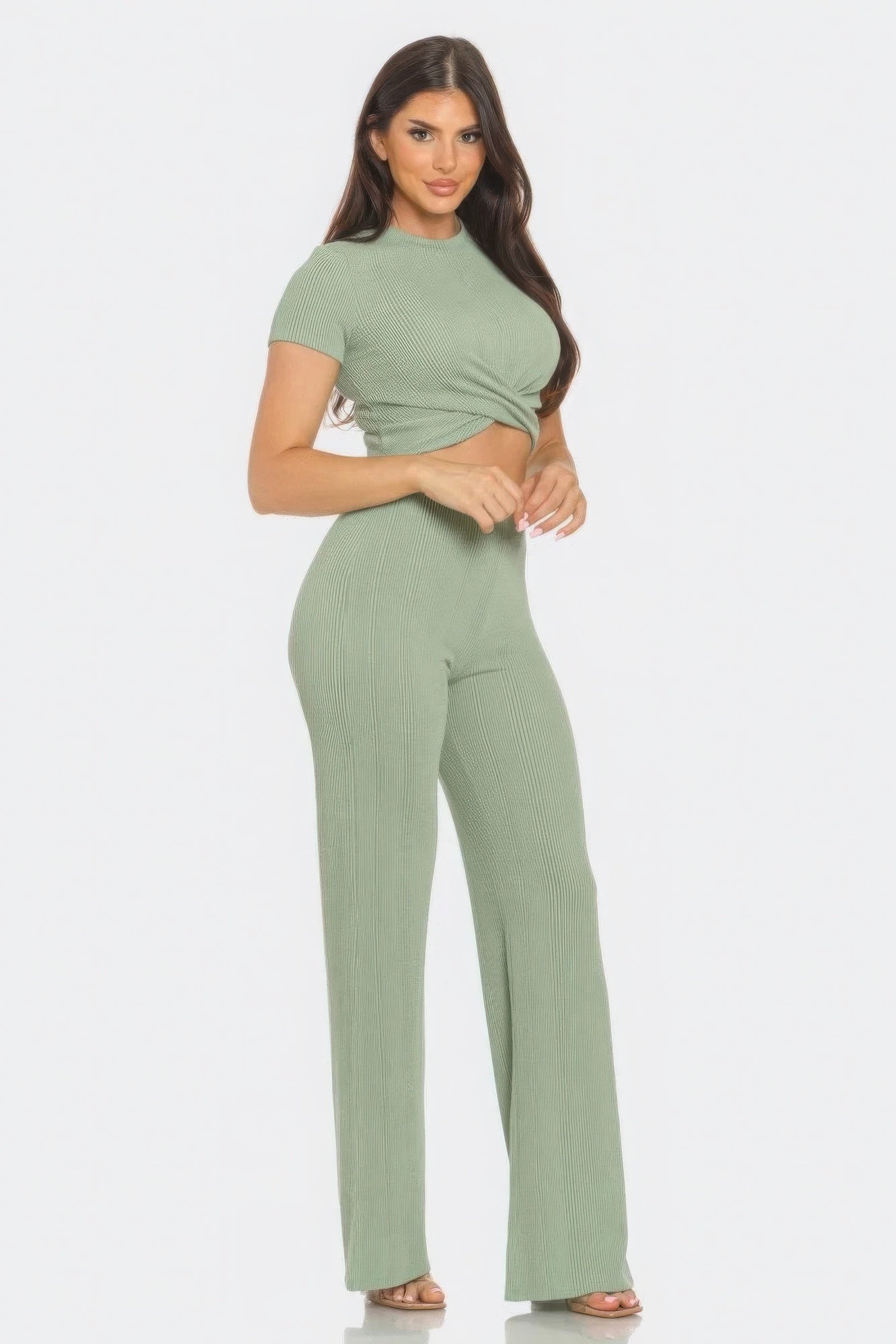 Stylish woman in front twist top and flare pants set, showcasing chic design and flattering fit in rib knit fabric.