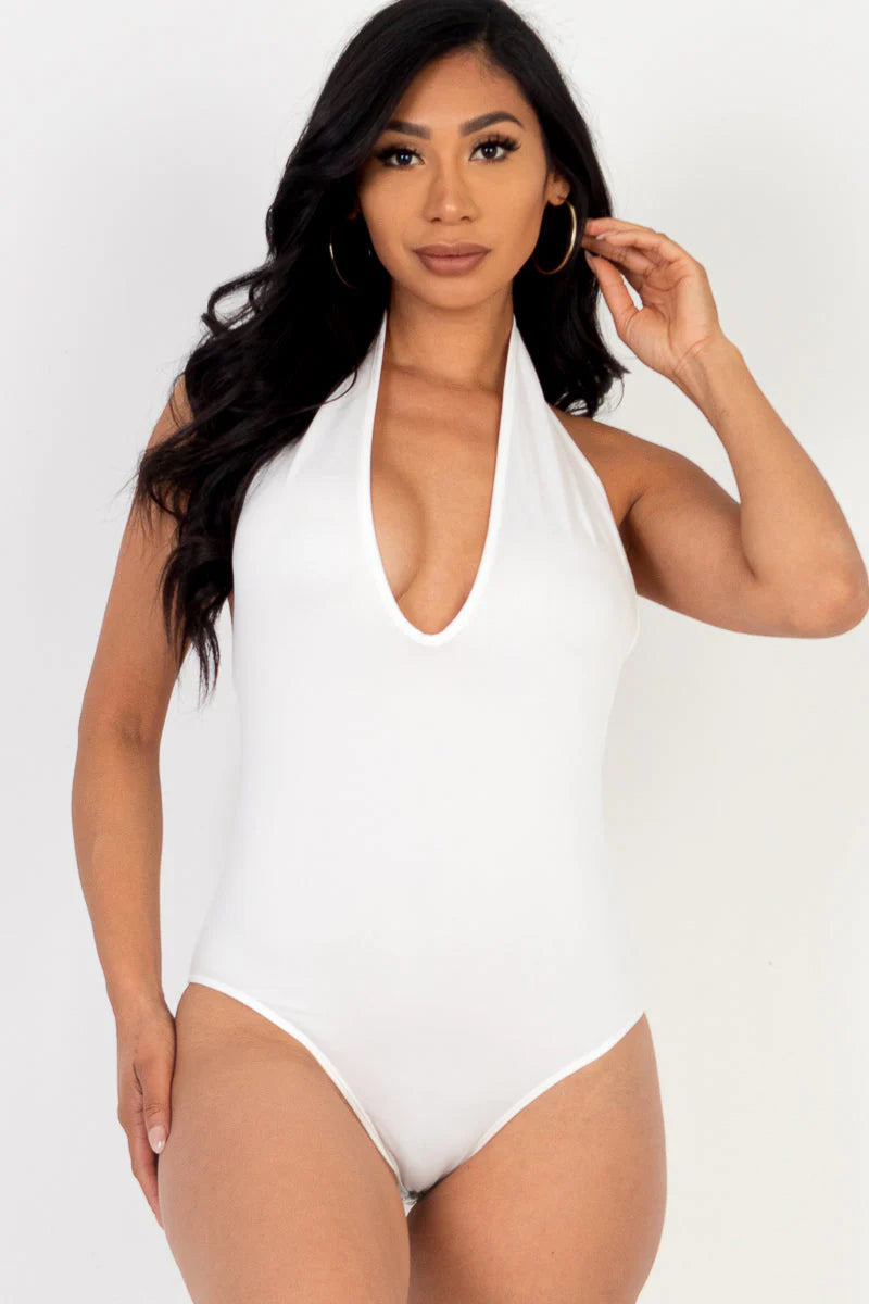 Woman wearing white halter neck bodysuit, showcasing soft, lightweight, high-stretch jersey fabric. Perfect for outings and parties.