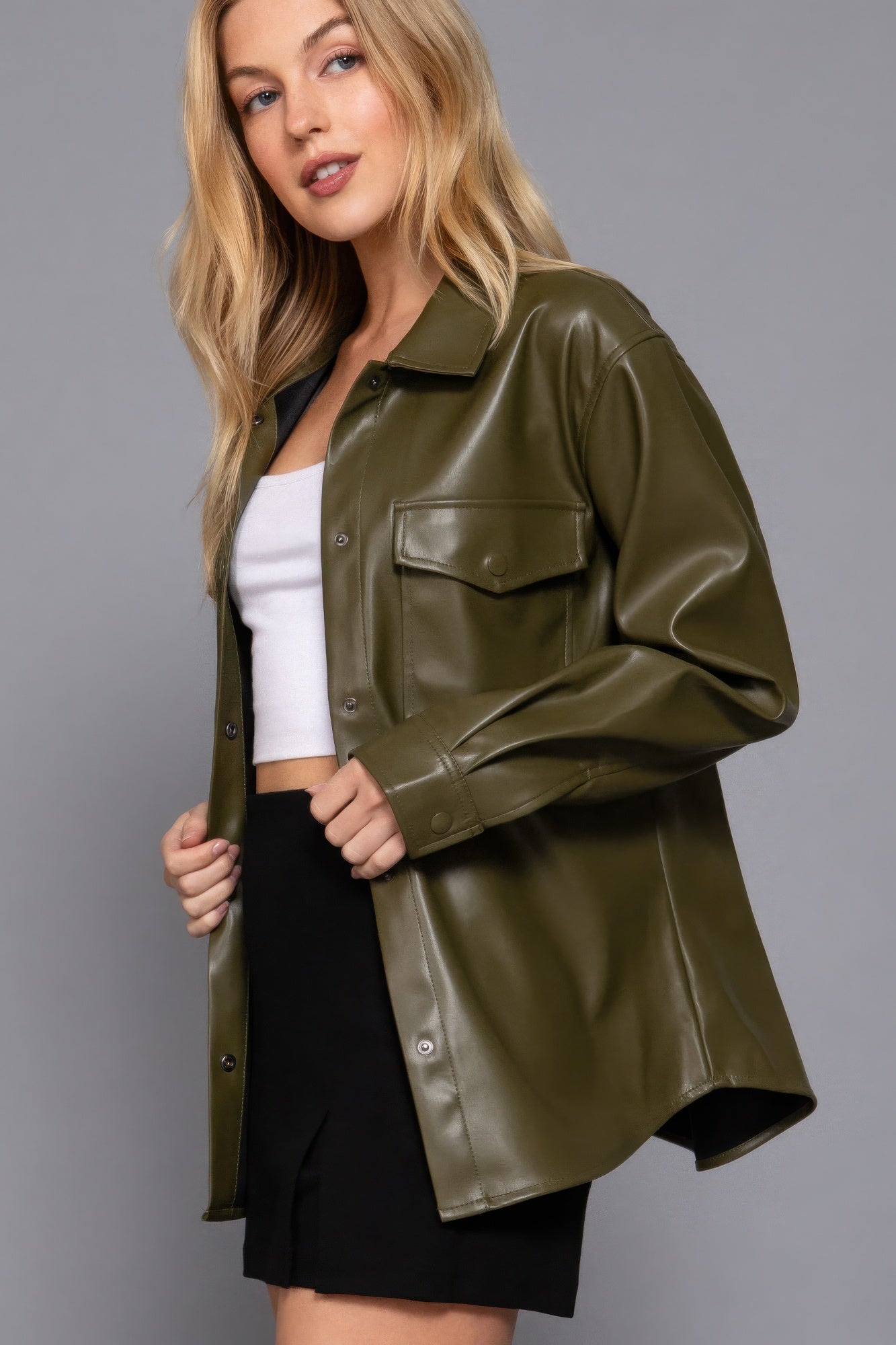 Olive faux leather shacket with long sleeves, styled over casual outfit, perfect for layering and elevating any look.