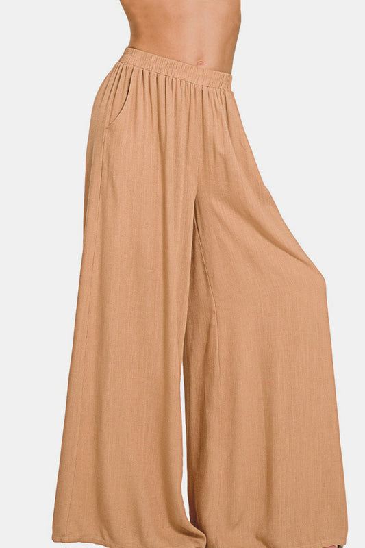 Pleated linen blend wide leg pants in beige, featuring basic style and opaque material, composed of 25% linen and 75% rayon.