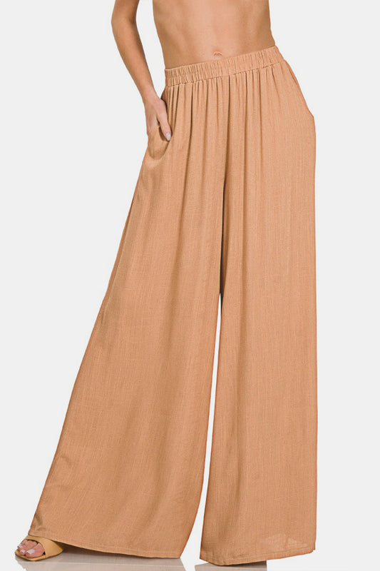 Beige pleated linen blend wide leg pants with elastic waistband, featuring a basic style and opaque finish for a chic look.