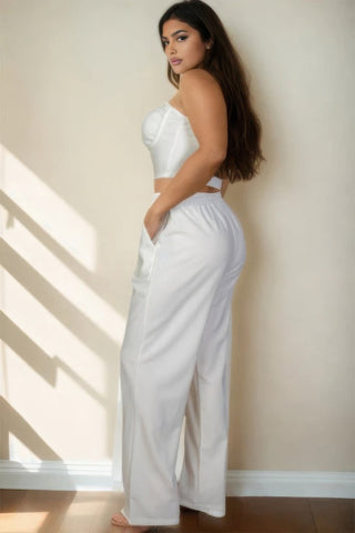 Plus size model wearing bustier crop cami top and slant pocket straight pants in soft crepe fabric, perfect for a chic, stylish look.